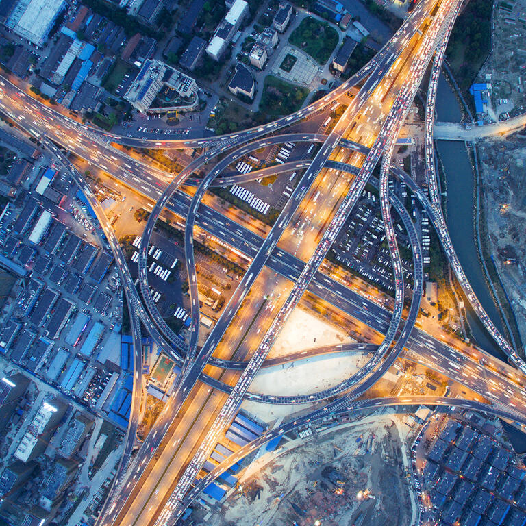 aerial view of traffic on road junction at night in hangzhou