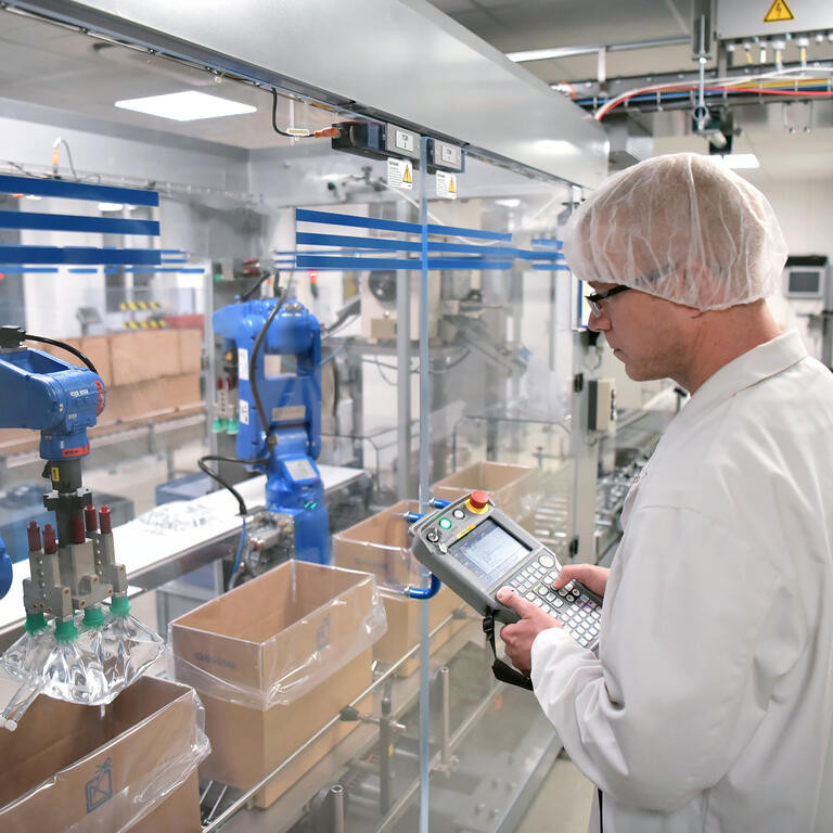 Workers in the pharmaceutical industry - production infusion bags