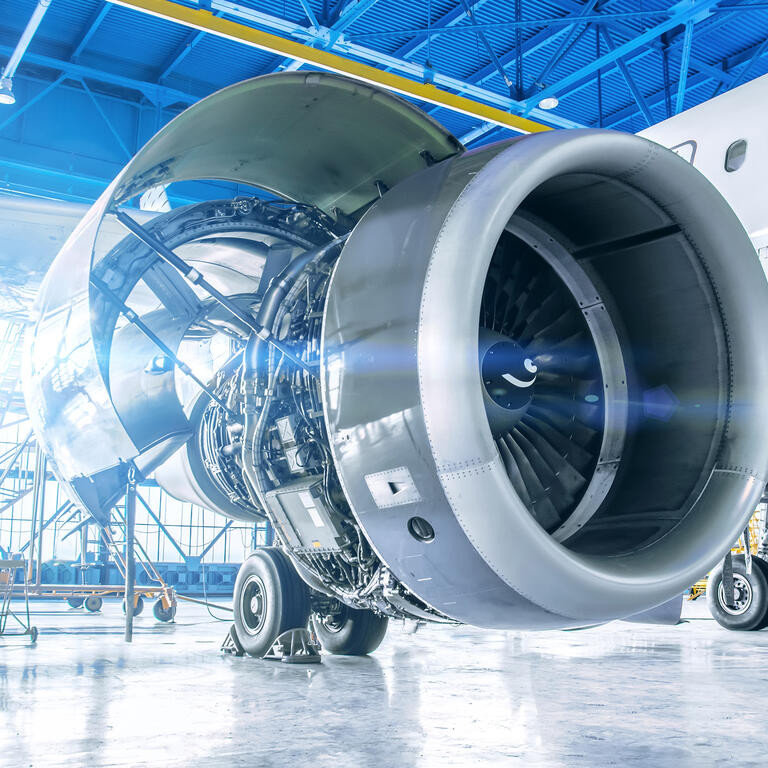 Industrial theme view. Repair and maintenance of aircraft engine on the wing of the aircraft.